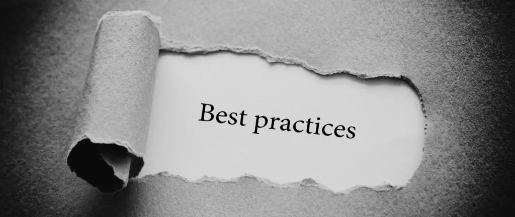 A sheet of grey paper is torn open to reveal the words Best practices typed on a white background beneath, subtly emphasising why schema markup is important for SEO.
